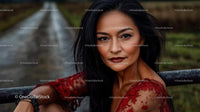 Elegant Woman in Red Lace Dress with Intense Gaze
