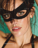 Woman with Glittering Black Mask and Radiant Skin