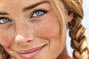 Freckled Woman With Blue Eyes and Braided Hair