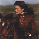 Elegant Woman Riding Horse in Vintage Equestrian Attire