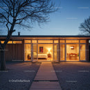 Modern Glass-Front House with Warm Interior Lighting at Dusk