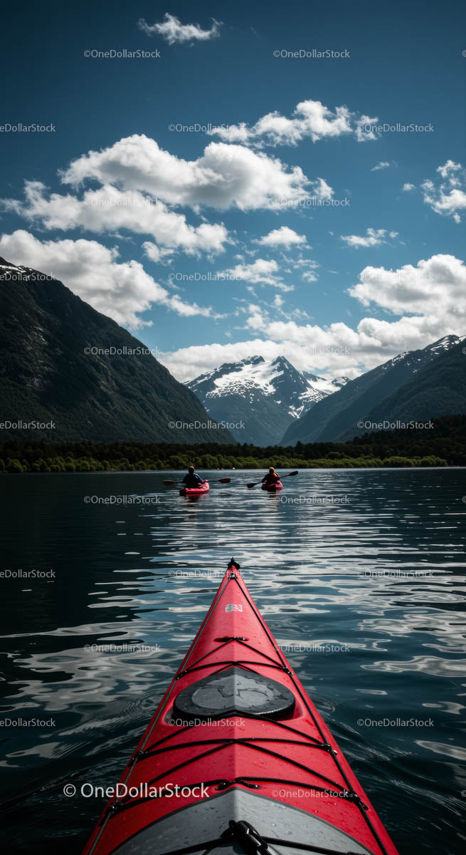 Kayaking on Mountain Lake with Snow-Capped Peaks