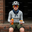 Cyclist Taking a Break with Snack and Drink