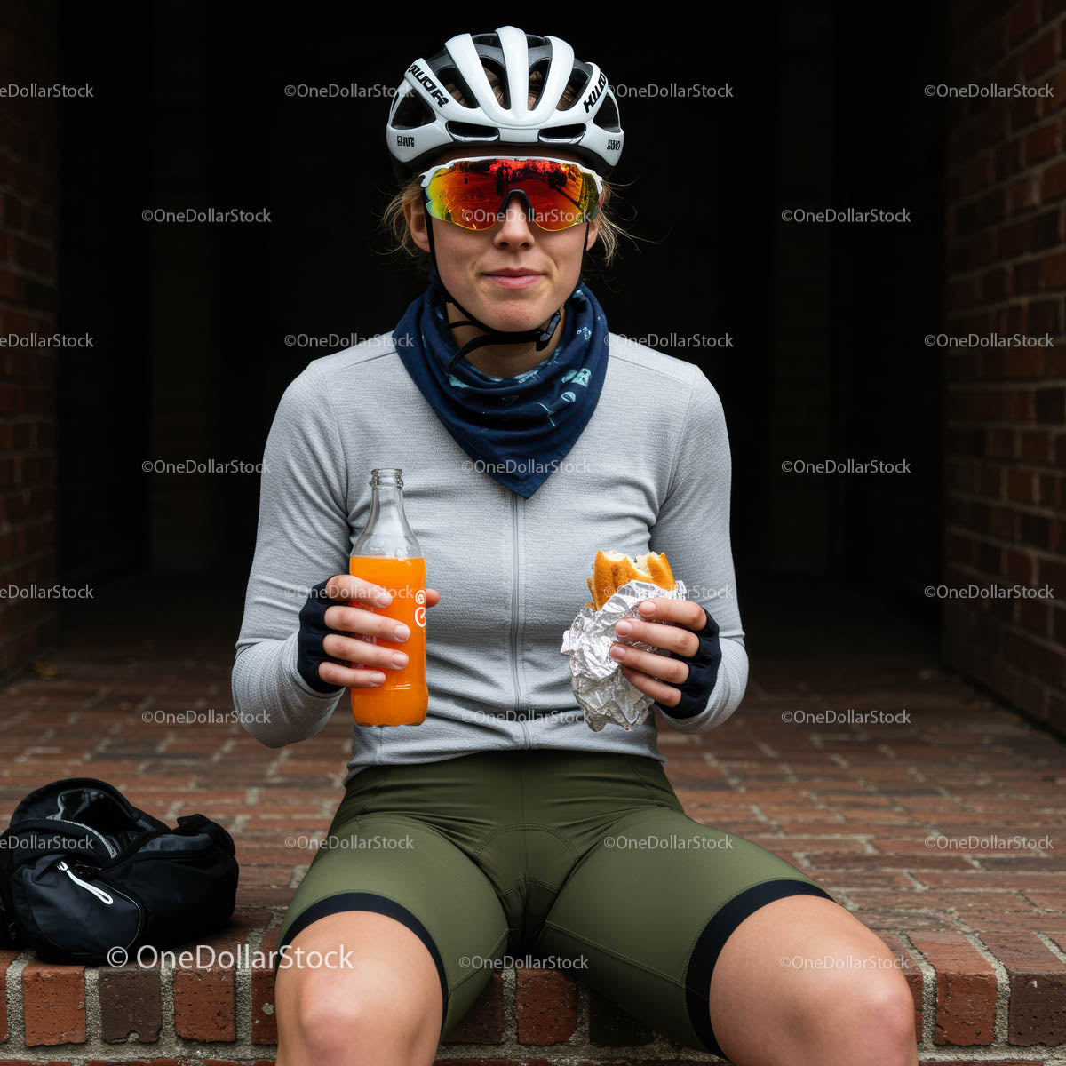 Cyclist Enjoying a Quick Snack Break in Urban Setting