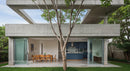 Contemporary Concrete House with Open Dining Area and Greenery