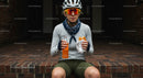Female Cyclist Taking a Break with Snack and Drink