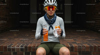 Female Cyclist Taking a Break with Snack and Drink