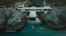 Modern Cliffside House Overlooking the Ocean with Kayaks
