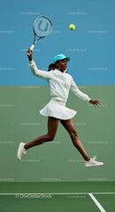 Dynamic Female Tennis Player in Action on Green Court
