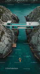 Modern Bridge House Over Turquoise Waters with Kayaker