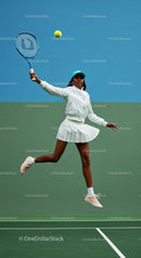 Athletic Female Tennis Player in Action on Green Court