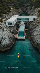 Modern Coastal House with Infinity Pool Over Rocky Cliffs