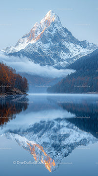 Majestic Snowy Mountain Reflecting in Serene Lake at Dawn