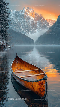 Canoe on Tranquil Lake with Majestic Snowy Mountains