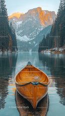 Wooden Canoe on Serene Lake with Majestic Mountain Backdrop