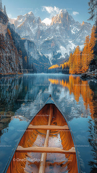 Canoe on a Serene Lake with Majestic Mountain Reflection
