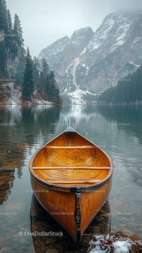 Wooden Canoe on Tranquil Lake with Snowy Mountain View