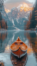 Wooden Canoe on Tranquil Lake with Majestic Mountain Backdrop