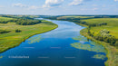 Aerial View of Meandering River Through Lush Countryside