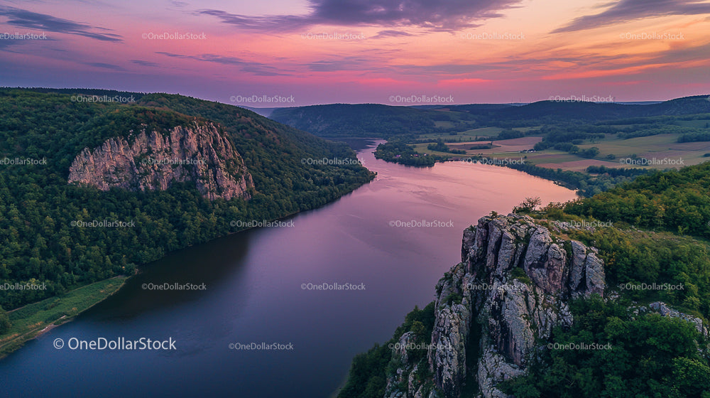 Tranquil River Landscape with Dramatic Cliffs at Sunset