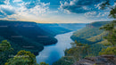 Scenic River Winding Through Verdant Mountain Valley at Sunset