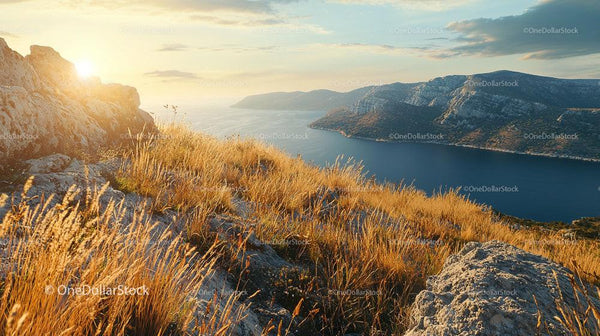 Golden Sunset Over Rocky Coastal Mountains