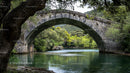 Stone Arch Bridge Over Serene River With Lush Greenery