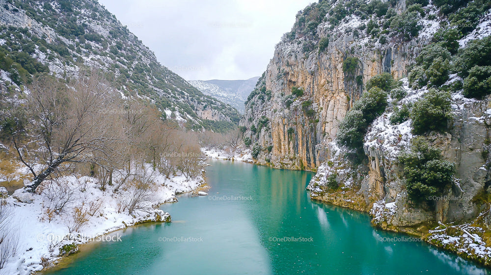 Snowy Canyon with Serene Turquoise River