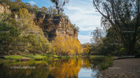 Scenic River Reflection in Rocky Autumn Landscape