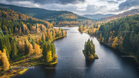 Tranquil River Winding Through an Autumnal Forest Landscape