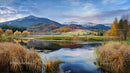 Serene Lake with Autumn Foliage and Misty Mountains