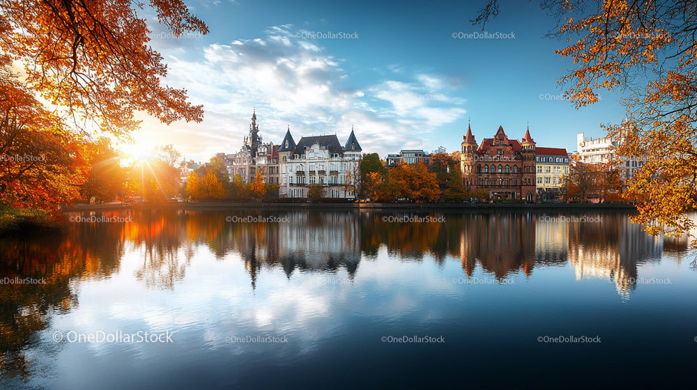 Scenic Autumn Cityscape with Reflective Lake and Colorful Trees