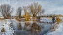 Tranquil Winter Landscape with Wooden Bridge Over Frozen River
