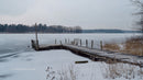 Rustic Wooden Pier on a Frozen Winter Lake