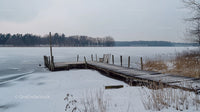 Rustic Wooden Pier on a Frozen Winter Lake