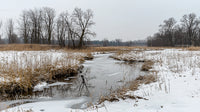 Frozen River Winding Through Winter Countryside