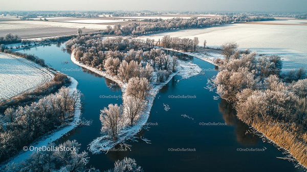 Aerial View of a Wintry River Bend in a Frosty Landscape