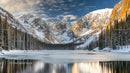 Snow-Capped Mountains and Frozen Lake in Winter Wilderness