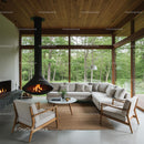Scenic Modern Living Room with Fireplace and Forest View