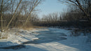 Tranquil Frozen River in a Winter Landscape