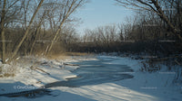 Tranquil Frozen River in a Winter Landscape