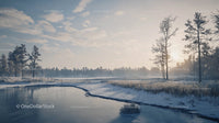 Scenic Winter Sunrise Over Frozen River and Snowy Trees