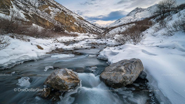 Serene Winter Alpine Landscape with Snowy Mountains and Stream