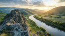Sunset Over Serene River Valley and Rugged Mountain Peaks