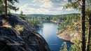 Tranquil Lake Surrounded by Pine Forest and Rocky Hillsides
