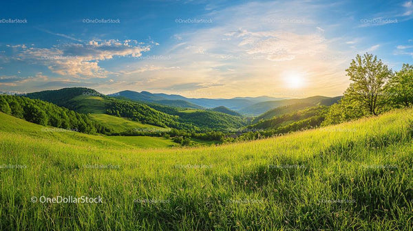 Breathtaking Sunset Over Green Hills and Valleys