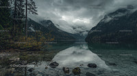 Misty Mountain Lake with Dramatic Clouds and Reflection