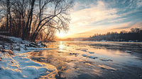 Winter Sunset over Frozen River with Bare Trees