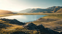 Golden Hour over Serene Lake and Majestic Mountains