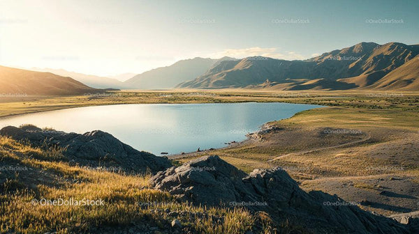 Golden Hour over Serene Lake and Majestic Mountains